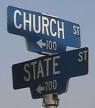 placa de rua: igreja ou estado, para onde ir?